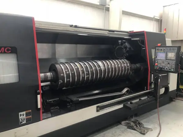 CNC lathe turning a large shaft