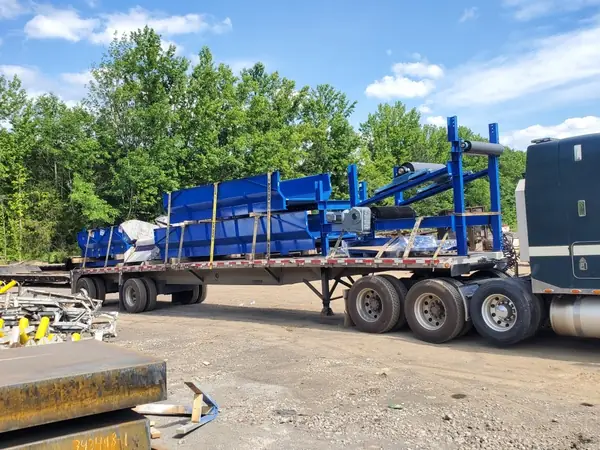 Painted fabricated equipment loaded on a flatbed for shipment