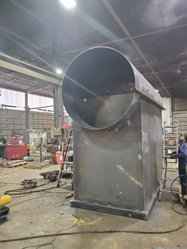 Fabricated round-to-square steel transition section