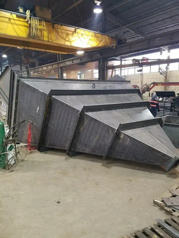 Heavy plate transfer chute fabrication on the shop floor