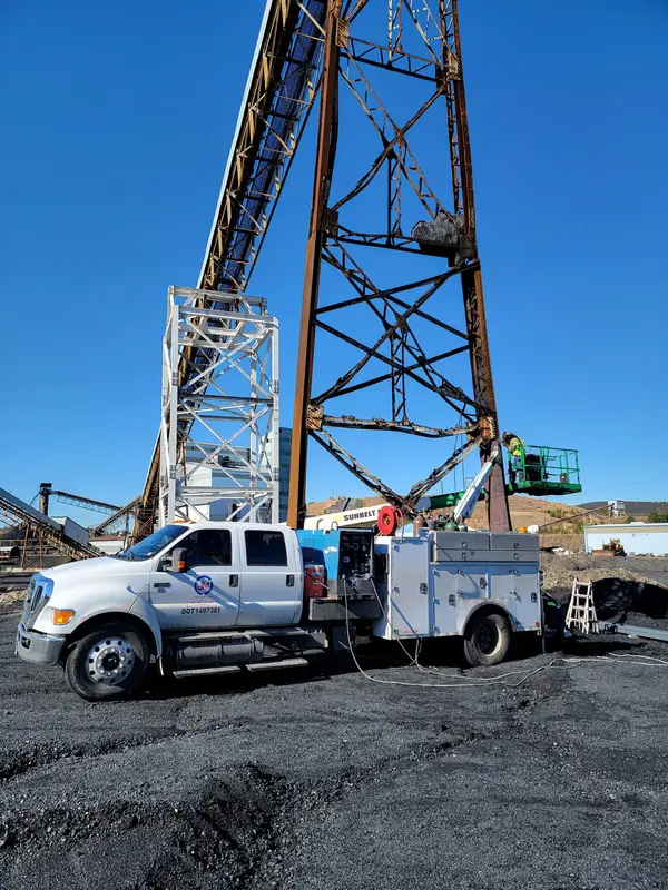 Field service truck at a conveyor tower