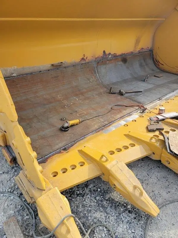 Loader bucket rebuild with new wear plate