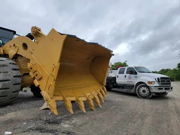 Rebuilt loader bucket with new cutting edge
