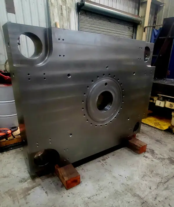 Large machined steel block with precision bores