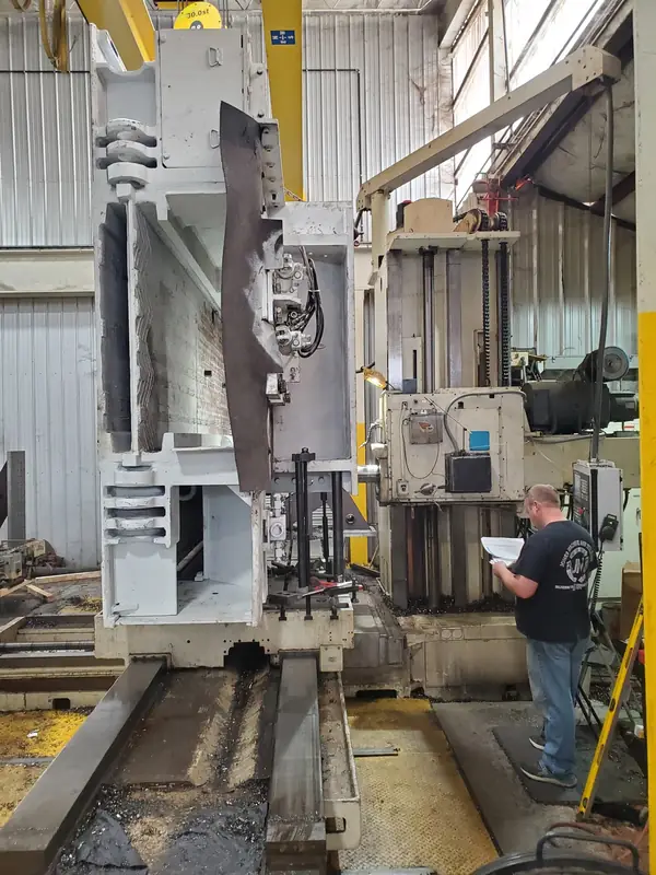 Machinist operating a CNC boring mill