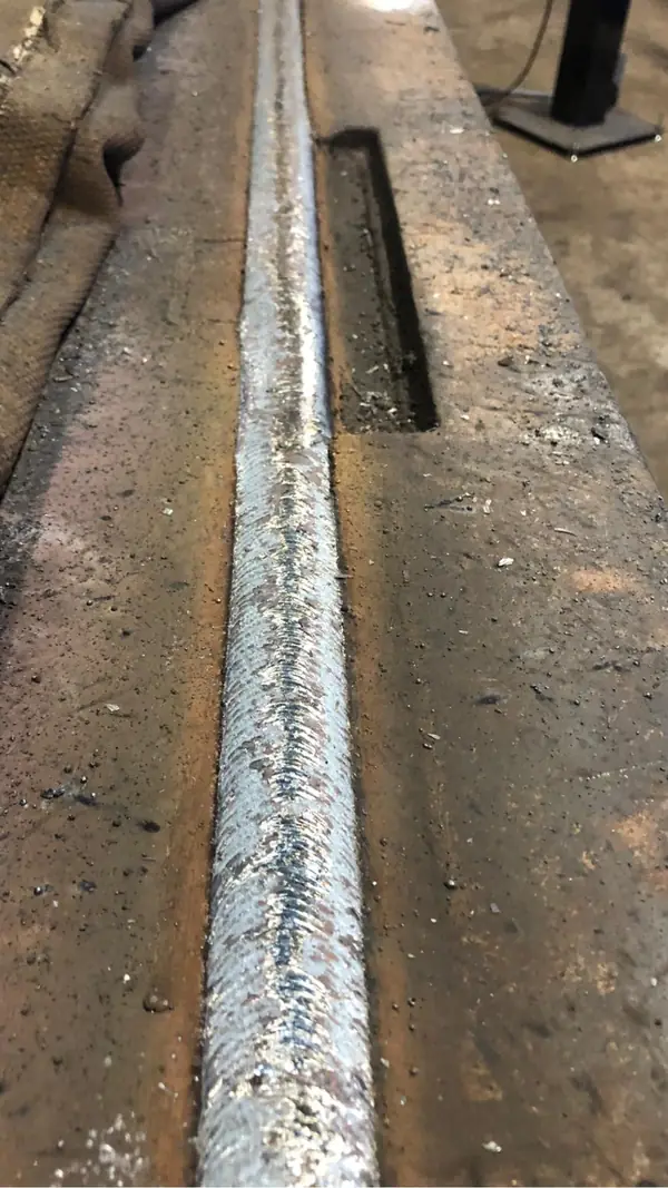 Close-up of a consistent robotic weld bead