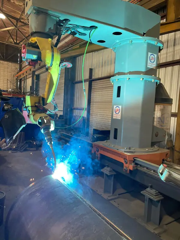 Robotic welder welding a steel assembly