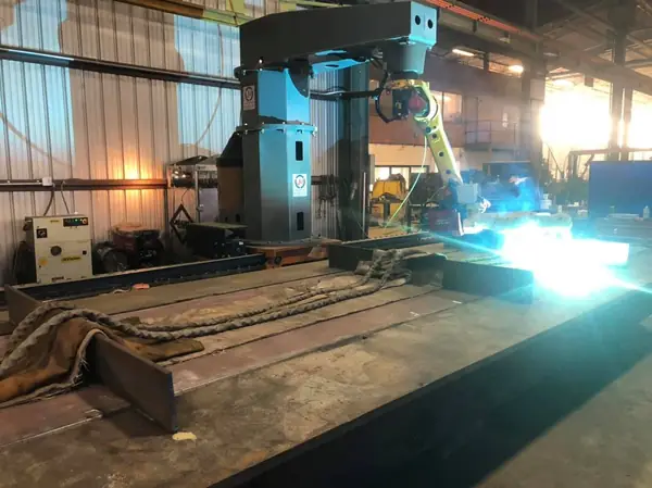 Robotic welding gantry working on a fabrication