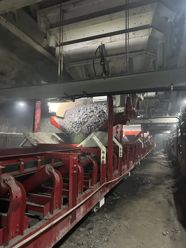 Underground mine belt conveyor with fabricated steel